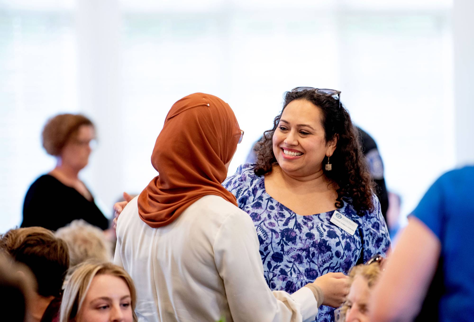 Two women talking and smiling